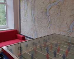 Map room with foosball table and map showing the bunkhouse lake district location
