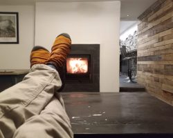 Warming legs near the fire after a day walking on Helvellyn