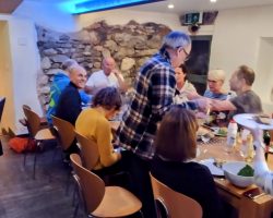 Hostel dining room with 14 diners